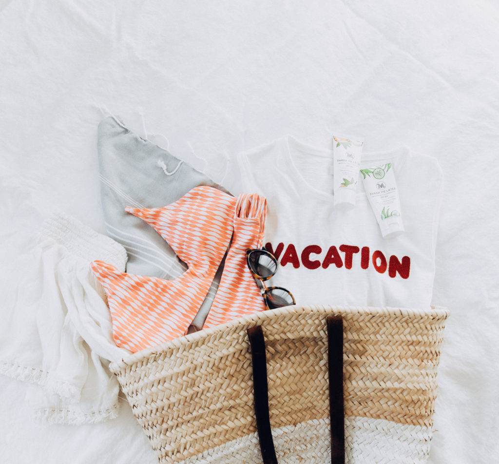 Travel Flatlay | What's In My Bag | Madewell VACATION tank | Midori Biknis | Turkish Towel | Aerie White Off The Shoulder Top | Thank Me Later Reef Safe Sunscreen | What To Pack | Travel Must Haves via @elanaloo + elanaloo.com